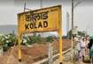 Kolad_a sign on a pole on a dirt road